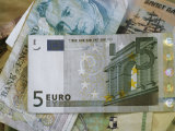 5-Euro Bill on Top of a Stack of Obsolete European Paper Money Photographic Print by Stephen Alvarez
