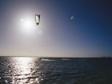 Kite Surfers Enjoying a Day on a Windswept Bay Photographic Print by Jason Edwards