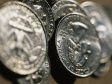 Stacks of Quarters Stand Askew in the Sunlight Photographic Print by Stephen Alvarez