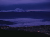 Cloud-Shrouded Mount Antisana Rises Above Quito Photographic Print by Pablo Corral Vega