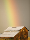 A Rainbow Arches from the Sky onto a Barn Photographic Print by Michael S. Lewis