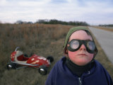 A Boy, Dressed to Travel, Stands in Front of His "Midget Racer" Photographie par Joel Sartore