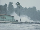 The Powerful Wind and Rain of a Hurricane Pummel a Building Photographie par Otis Imboden