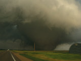 A Massive F4 Category Tornado Rampages Towards a Storm Chasers Van Photographic Print by Peter Carsten