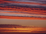 Clouds Lit up by a Brilliant Sunset Photographic Print by Robert Madden