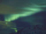 The Aurora Borealis Creates Light Patterns in the Northern Sky Photographic Print by Paul Nicklen