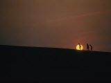 Surfers at Sunset on the Outer Banks Photographic Print by Emory Kristof