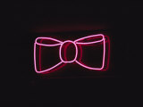 A Bright Pink Neon Bowtie Outside a Restaurant Fotoprint van Stephen St. John