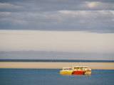 Three Colorful Fishing Boats Sit off the Shore of the Kalbarri Resort Photographie par Bill Ellzey