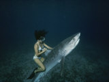 A Woman Rides a Shark Photographic Print by Nick Caloyianis
