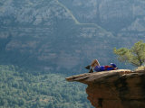 A Hiker Resting at a Cliffs Edge Photographic Print by Dugald Bremner