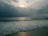 Dramatic View of a Stormy Sunrise and the Foamy Surf Photographie par Brian Gordon Green