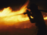 Fire-Fighter Battling a Blaze at Night Photographic Print by Mark Thiessen