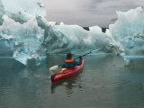 A Kayak Paddler Passes Sculpted Icebergs in Tracy Arm Fjord Photographic Print by Ralph Lee Hopkins