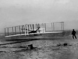 Orville Wright Taking Plane For 1st Motorized Flight as Brother Wilbur Wright Looks at Kitty Hawk Photographie