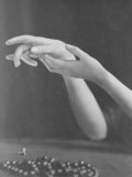 Close Up of a Woman's Graceful Hands with Ring and Necklace in Foreground Photographic Print by E O Hoppe