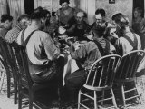 Farm Hands Sitting at Dinner Table and Dishing Out Food as One Woman Stands by to Serve Them Premium Photographic Print by Mcmanigal 