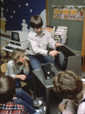 Kids Getting a Computer Lesson Premium Photographic Print by Charles Bonanno