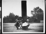 Children Holding Hands in a Circle as They Dance Around a Pole with Their Backs to It Photographie par Wallace G. Levison
