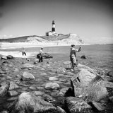Surf Casting Fishermen Working the Shore Near the Historic Montauk Point Lighthouse Photographic Print by Alfred Eisenstaedt