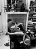 Amorous Couple Wrapped Up with Each Other During a Cocktail Party at a Private Home Photographie par Francis Miller