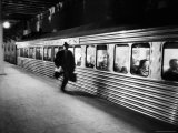 Commuter on the New York New Haven Line Running to Catch Train Pulling Out of Grand Central Station Photographic Print by Alfred Eisenstaedt