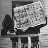 Man Reading the Comics Section of the Detroit Times on a Typical Sunday During WWII Premium Photographic Print by Walter Sanders Man Reading the Comics Section of the Detroit Times on a Typical Sunday During WWII Premium Photographic Print by Walter Sanders