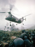 American Helicopter H-21 Hovering Above Soldiers in Combat Zone During Vietnam War Premium Photographic Print by Larry Burrows
