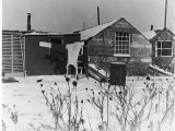 Ex Soldier's Shanty Town in Winter with Laundry Hanging on Line and Snow Premium Photographic Print
