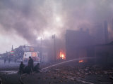Firemen Are Protected by Police While They Battle Smoking Blaze After Race Riots Rock the City Premium Photographic Print by Declan Haun