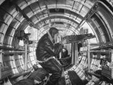 Crewman Poking His 50 Cal. Machine Gun Out of Side Window of B-17E Flying Fortress During WWII Photographic Print by Frank Scherschel