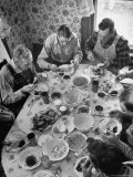 Harvest Farm Hands Eating Lunch Served by Their Wives in Kitchen of Farmhouse Photographie par Alfred Eisenstaedt