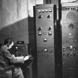 Agent of the FBI Listening to a Message Being Transferred Via Radio Premium Photographic Print by Thomas D. Mcavoy