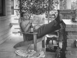 Man Taking Off Work and Sitting on Porch Premium Photographic Print by John Florea