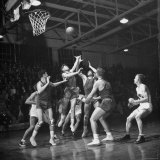 Champion Amateur Phillips 66ers Blocking Out Members of the Opposing Team Photographic Print by Cornell Capa