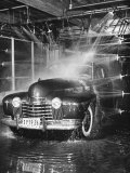 Car Rolling Through the Car Wash at Rockefeller Center Photographie par Bernard Hoffman