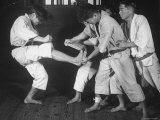Japanese Karate Student Breaking Boards with Kick Premium Photographic Print by John Florea