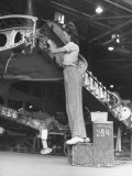 Consolidated Aircraft Worker Using a Two Step Bench For Working on the Fire Wall Premium Photographic Print by John Florea
