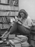 French Actress Barbara Laage, Alone in Her Apartment Reading Premium Photographic Print by Nina Leen