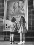 Children Looking at Posters Outside Movie Theater Premium Photographic Print by Charles E. Steinheimer
