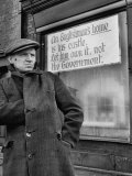 Man Standing Beside Anti Labor Government Sign on Shop Premium Photographic Print by Nat Farbman