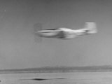 Airplane in Flight, Speed Blurred Premium Photographic Print by J. R. Eyerman