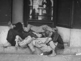 Coolies Taking an Afternoon Nap on Steps of a Hotel Premium Photographic Print by John Florea