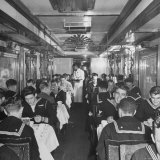 G.I. Personnel and Their Wives Eating in Dining Car While Civilians Will Have to Wait Until Later Photographic Print by Sam Shere