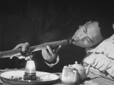 Customer Smoking Opium in an Opium Den Premium Photographic Print by George Lacks