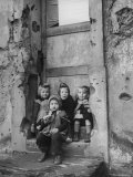 Little Girls Sitting on a Doorstep Together Premium Photographic Print by Nat Farbman