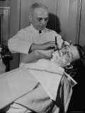 Barber Victor E. Aceto Shaving Passenger Aboard the 20th Century Limited Premium Photographic Print by Alfred Eisenstaedt