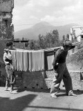 Boys Working in Pasta Factory Carry Rods of Pasta to Drying Rooms Premium Photographic Print by Alfred Eisenstaedt Boys Working in Pasta Factory Carry Rods of Pasta to Drying Rooms Premium Photographic Print by Alfred Eisenstaedt