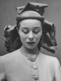 French Model Showing Off New Spring Hat Design Photographie par Gordon Parks