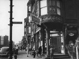 Corner Drugstore and Pedestrian Traffic on W. Oak St. in the Italian Section of Chicago Photographic Print by Gordon Coster